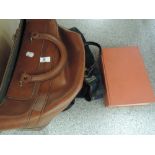 A vintage leather bag and a Readers encyclopedia