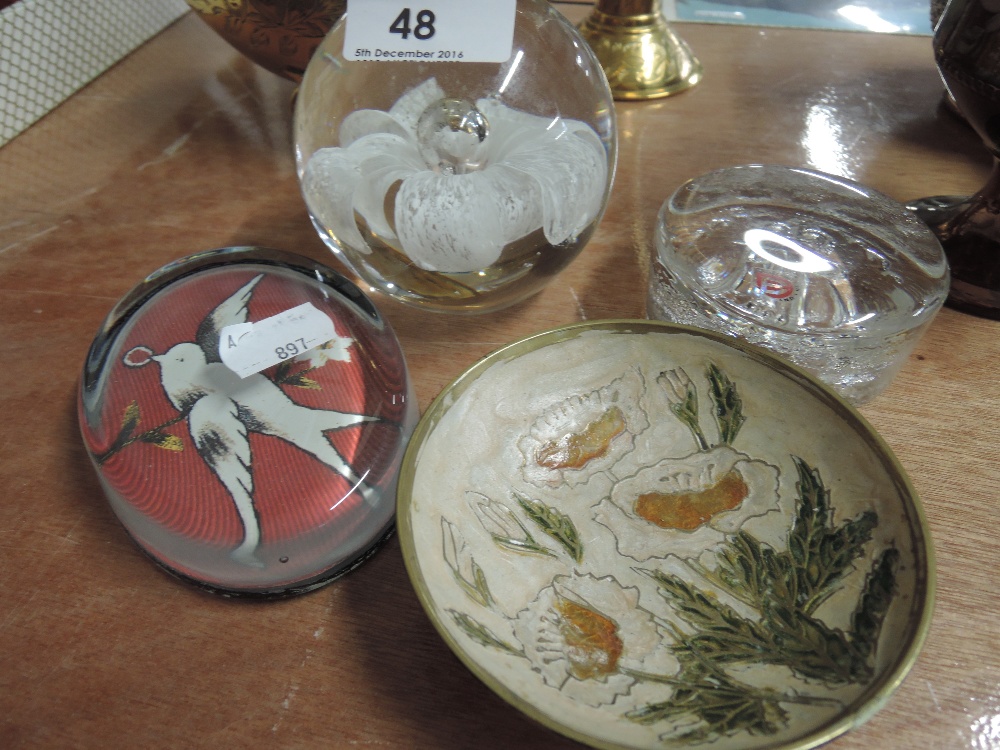 A selection of paperweights and brass enamelled pin dish