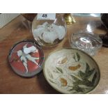 A selection of paperweights and brass enamelled pin dish
