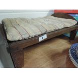 A vintage childs toy bed