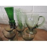 A selection of green glass including water jug and glasses, art glass vases