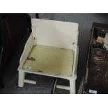A vintage wooden child's potty chair (collectors item only)