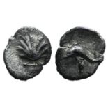 Southern Apulia, Tarentum, c. 325-280 BC. AR 1/4 Litra (8mm, 0.23g, 10h). Cockle shell. R/ Dolphin