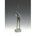 A BRONZE GROUP OF A CRANE, standing on the back of a tortoise. 37cm high