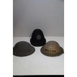 A COLLECTION OF THREE MILITARY HELMETS,including two early 20th century British army helmets, one