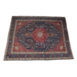 A LARGE PERSIAN TABRIZ WOOL CARPET, the large central field woven with broad floral medallion