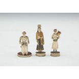 A GROUP OF THREE INDIAN CARVED IVORY CHESSMAN, 19TH CENTURY, each modelled as individual figures,