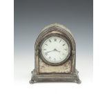 A SILVER PLATED MANTLE CLOCK, 19TH CENTURY, in the Gothic style. 19cm high