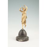 A FRENCH GILT BRONZE MODEL OF A DANCING LADY, the elegant figure with raised arms, balancing on