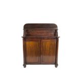 AN EARLY VICTORIAN MAHOGANY CHIFFONIER SIDECABINET, with raised panel back and shelf above twin