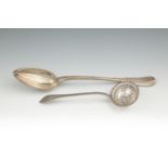 A FRENCH SILVER DIVIDING SPOON, 19TH CENTURY, fiddle and thread pattern, engraved with crest to