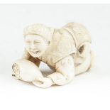 A JAPANESE CARVED IVORY OKIMONO, 19th century, of a kneeling figure holding an oijime, signed. 5cm