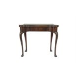 A GEORGE III MAHOGANY FOLDING TOP CARD TABLE, opening to reveal an interior, baise lined and with