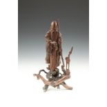 A JAPANESE ROOTWOOD CARVING OF FUKUROKUJU, 19th century, the God of Wisdom, modelled in standing