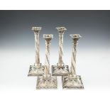 A SET OF FOUR LATE VICTORIAN SILVER TALL TABLE CANDLESTICKS, London 1897, mark of Langley, Archer