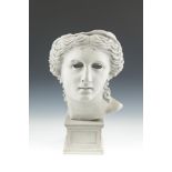 A CONTINENTAL FAUX MARBLE BUST, of 20th century after the antique, on square plinth base. 50cm