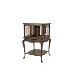 AN EDWARDIAN INLAID MAHOGANY SQUARE REVOLVING BOOKCASE, with pierced lattice sides, raised on a