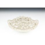 A BELLEEK CHINA FIRST PERIOD OVAL COVERED AND TWIN HANDLED LATTICEWORK BASKET, with naturalistic