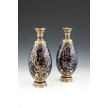 A PAIR OF ROYAL CROWN DERBY GILT EMBELLISHED OVOID VASES , c.1900, each with deep blue ground