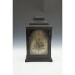 A GEORGE II EBON CASED BRACKET CLOCK, by R. Henderson, the domed top with brass carrying handle