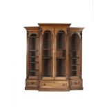 A VICTORIAN MAHOGANY BREAKFRONT BOOKCASE, with moulded cornice above four tall arch top glazed