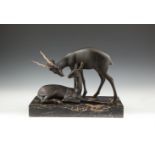 A 20TH CENTURY BRONZED GROUP MODELLED AS ANTELOPE, on black marble plinth. 29cm high x 40cm wide