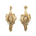 A PAIR OF VICTORIAN GILTWOOD AND GESSO WALL SCONCES, carved with ribbon head surmount above a