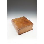 A 19TH CENTURY FRUITWOOD BIBLE BOX shaped in the form of a large book, the spine sliding open to