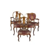 AN EDWARDIAN INLAID MAHOGANY NINE PIECE SALON SUITE, comprising a three seat settee, two