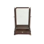 A GEORGIAN MAHOGANY CRUTCH FRAME TOILET GLASS, the square side columns supporting a rectangular