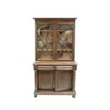 A VICTORIAN MAHOGANY TWO-DOOR BOOKCASE, the moulded cornice above a pair of cross-glazed doors