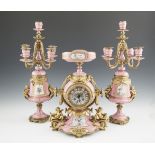 A 19TH CENTURY FRENCH CLOCK GARNITURE OF PINK ‘SEVRES’ STYLE PORCELAIN WITH GILT BRASS MOUNTED