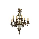 A FRENCH BRASS AND MILK GLASS EIGHT LIGHT CHANDELIER, the baluster and bell shaped column supporting