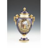 A COALPORT TWO HANDLED URN AND COVER, painted by Keeling, decorated with a romantic scene
