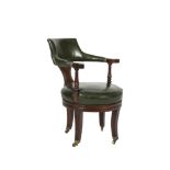 A REGENCY MAHOGANY FRAMED SWIVEL OFFICE ARMCHAIR, with raised padded back, armrests and circular