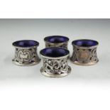 TWO PAIRS OF EDWARDIAN IRISH SILVER SALTS, in the form of circular dish rings, Dublin 1902 & 1903,