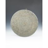 A LARGE BRASS AND SILVER INLAID CAIRO-WARE CHARGER, 74cm diameter; together with a Persian brass