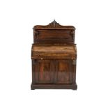 A VICTORIAN ROSEWOOD ROLL TOP WRITING CABINET with raised back above a cylinder desk with fitted