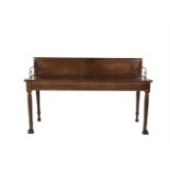 AN IRISH REGENCY MAHOGANY SERVING TABLE, of rectangular form, the panelled gallery back with