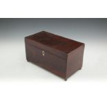 AN EARLY 19TH CENTURY INLAID MAHOGANY RECTANGULAR TEA CADDY, the crossbanded top enclosing a