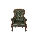 A VICTORIAN MAHOGANY FRAMED BALLOON BUTTON BACK GENTLEMAN'S ARMCHAIR, covered in green hide and