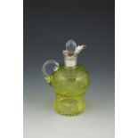 A SMALL OLIVE GREEN SILVER MOUNTED CUT GLASS DECANTER AND STOPPER, London 1911, maker's mark of Army