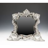 A LARGE EDWARDIAN SILVER DRESSING TABLE MIRROR, London 1903, mark of William Comyns & Sons Ltd.,