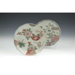 TWO JAPANESE FAMILLE VERTE DISHES, probably 18th century, each of circular form with wavy rim,