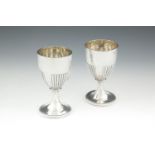 A PAIR OF GEORGE III SILVER GOBLETS, by Thomas Robbins, London 1805, of tapering cylindrical form,