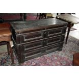 AN OAK DRAWER FRONT COFFER, 17TH CENTURY, panelled mouldings, planked lid, the frieze with initials.