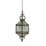 A BRASS HEXAGONAL HALL LANTERN, 19TH CENTURY, with bevelled glass plates, suspended from a corona.