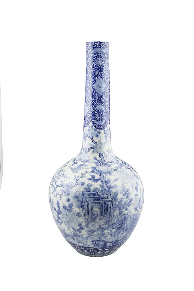 A LARGE JAPANESE BLUE AND WHITE BOTTLE VASE, c.1900, the tapering neck painted with a dense