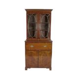 A GEORGE IV MAHOGANY SECRETAIRE BOOKCASE, the moulded cornice with a band of Greek Key decoration,