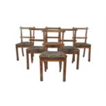 A SET OF SIX VICTORIAN PALE OAK RAIL BACK DINING CHAIRS in the manner of Pugin, having padded